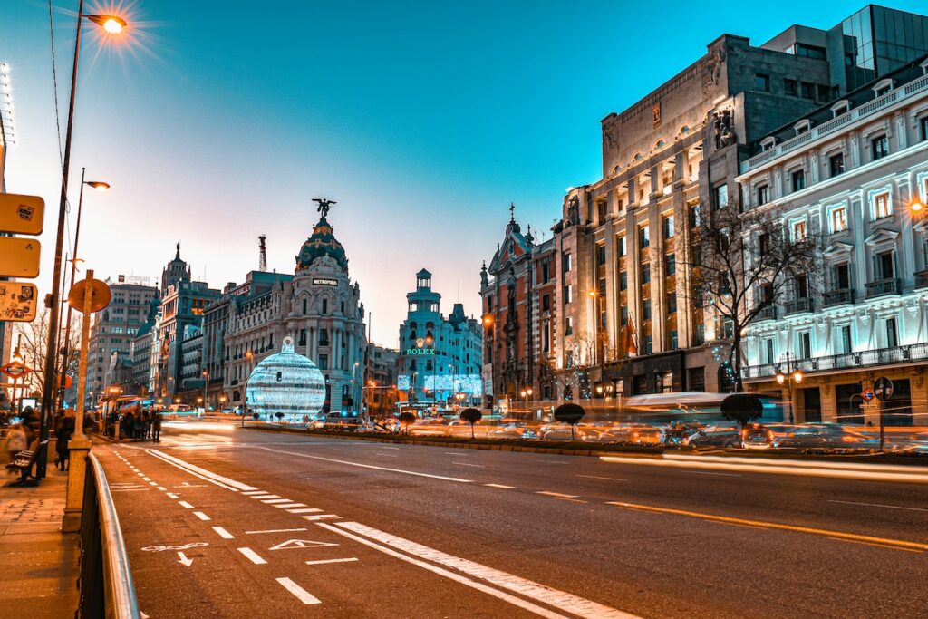 # The Best Luxury Hotels in Madrid: A Guide to the Spanish Capital's Finest Stays

Madrid has undergone a remarkable transformation in recent years, cementing its place as one of Europe's premier luxury travel destinations. Spain's capital has long dazzled visitors with its world-class museums — the Prado, the Reina Sofía and the Thyssen-Bornemisza form the celebrated "Golden Triangle of Art" — but a wave of high-end hotel openings has elevated the city's status still further. The Mandarin Oriental Ritz, Four Seasons, Rosewood and JW Marriott have all planted flags here, joining a roster of long-established grand hotels and intimate boutique properties that make the city a compelling rival to Paris, London and Rome for discerning travellers.

Most of Madrid's luxury hotels are concentrated in a handful of key neighbourhoods. The city centre, around Puerta del Sol and the elegant Paseo del Prado, offers unbeatable cultural access — guests can walk to the great art museums, the lively Plaza Mayor and the historic Habsburg quarter. The upscale Salamanca district, anchored by the Paseo de la Castellana and the celebrated Calle Serrano shopping boulevard, attracts those who want proximity to haute couture and fine dining. A short distance north, the leafy Chamberí neighbourhood rewards travellers seeking quieter, more residential elegance. Wherever you stay, Madrid's world-class gastronomy, vibrant nightlife and efficient metro system make the city a pleasure to explore on any terms.

---

## 1. Mandarin Oriental Ritz, Madrid

Occupying its legendary Belle Époque palazzo steps from the Prado, the Mandarin Oriental Ritz, Madrid is the city's most storied grand hotel. César Ritz opened it in 1910, and after a painstaking multi-year restoration it reopened under Mandarin Oriental's stewardship in 2021 as one of the finest hotels in Europe. The building's ornate façade and chandeliered interiors have been immaculately preserved, while every detail — from the hand-embroidered linens to the bespoke amenities — has been brought to a new standard of perfection. The hotel is a two-minute stroll from the Prado and close to the Retiro Park, Madrid's elegant green lung.

The hotel's 100 rooms and 53 suites are dressed in soft golds and creams, reflecting the building's century of history. Opt for a Grand Terrace Suite for private outdoor space with rooftop city views. Dining centres on Deessa, the Michelin-starred restaurant where acclaimed chef Quique Dacosta serves theatrical tasting menus of extraordinary invention. The subterranean spa features a stunning chandelier-lit swimming pool, steam rooms and a full menu of bespoke treatments. The gilded Píctura bar — named for the hotel's extensive art collection — is one of Madrid's most beautiful spots for a cocktail.

**Address:** Plaza de la Lealtad, 5, 28014 Madrid.
**Best for:** Couples celebrating a special occasion, culture lovers and anyone who wants to stay in Madrid's most historically resonant address.

---

## 2. Four Seasons Hotel Madrid

The first Four Seasons in Spain opened in 2020 inside the extraordinary Centro Canalejas — a complex that unites seven painstakingly restored historic buildings, the oldest of which dates to 1887. Situated right in the city centre near Puerta del Sol, it is one of the most architecturally remarkable hotels in Europe, with over 3,700 original artefacts — stained glass, gilt columns, antique teller counters — incorporated into its interiors alongside more than 2,500 contemporary artworks. Luxury shopping at the adjacent Galería Canalejas, home to over 40 prestigious brands, is accessible directly from the hotel lobby.

The 200 rooms and 39 suites are the most spacious in central Madrid, with floor-to-ceiling windows and some featuring private terraces or split-level layouts; the Grand Suite is a particular standout. Dining is headlined by Dani García's rooftop brasserie, where the three-Michelin-starred chef brings Andalusian flair and sweeping city views together in equal measure; the award-winning gastrobar Isa adds Asian-inspired tapas and craft cocktails. The four-level spa is Madrid's largest wellness destination, featuring a 14-metre indoor pool, sauna, steam room, hydro pool and eight treatment rooms. The hotel is within easy walking distance of the Prado, Thyssen and Reina Sofía museums.

**Address:** Calle de Sevilla, 3, 28014 Madrid.
**Best for:** Travellers who want the gold standard of luxury service in the absolute heart of the city, with world-class dining and spa facilities on site.

---

## 3. Rosewood Villa Magna

Rosewood Villa Magna occupies one of Madrid's most covetable addresses — the Paseo de la Castellana in the heart of the Salamanca district, the city's most exclusive enclave of luxury shopping, fine dining and elegant residential streets. The hotel closed for full renovation in 2020 and reopened as a Rosewood property in 2021, with renowned Spanish architect Ramón de Arana leading a redesign that added a striking staircase and a pair of reflecting pools flanking century-old cedar and carob trees at the entrance. Landscape designer Gregorio Marañón transformed the gardens into a secret-garden sanctuary of pergolas, sculptures and fountains.

The 101 guestrooms, 49 suites and four signature houses balance the feel of a contemporary Spanish villa with warm, residential luxury. The Royal Anglada House, the hotel's grandest suite, occupies the top floor with two bedrooms, a dining room, a work studio, an outdoor terrace and an elevated kitchen. The Flor y Nata breakfast salon is a Madrid institution, while the hotel's two bars provide ideal settings for aperitivo hour. Dining, wellness and activities all carry the Rosewood hallmark of thoughtful personalisation; the spa offers bespoke treatments, and the hotel's concierge team curates neighbourhood experiences in Salamanca's boutiques and galleries. Cibeles square and the Retiro Park are a short walk away.

**Address:** Paseo de la Castellana, 22, 28046 Madrid.
**Best for:** High-net-worth shoppers, design enthusiasts and those who want a chic residential neighbourhood feel alongside five-star Rosewood service.

---

## 4. Palacio de los Duques Gran Meliá

Few hotels in Madrid can match the theatrical setting of Palacio de los Duques Gran Meliá, a luxury urban resort in the historic Habsburg district that fuses a 13th-century convent with the 19th-century Palace of the Dukes of Granada de Ega. Its avant-garde interiors draw inspiration from Velázquez's Las Meninas, with rich velvet furnishings and Renaissance-influenced details throughout. Positioned barely 300 metres from the Royal Palace, the Royal Theatre and the Cathedral of the Almudena, it is perfectly placed for guests with a passion for Madrid's royal and artistic heritage; the Plaza Mayor is also a short stroll away.

The hotel's 160 rooms and 20 suites — including family suites specially designed for multigenerational travellers — look out over either the city or the hotel's remarkable 1,000-square-metre internal courtyard garden, a lush green oasis at the heart of the property. The Jardín de los Duques restaurant serves contemporary Castilian cuisine in the garden itself, while a rooftop pool terrace and bar offer sweeping 360-degree panoramas across Madrid's skyline, including views of the Royal Palace. The Thai Room wellness centre provides a speciality menu of rejuvenating Thai massage therapies alongside a 24-hour fitness suite.

**Address:** Calle de la Bola, 6, 28013 Madrid.
**Best for:** History enthusiasts, families seeking royal-quarter luxury and travellers who appreciate dramatic architecture with a genuine sense of place.

---

## 5. Santo Mauro, a Luxury Collection Hotel

Hidden in the leafy, residential streets of the Chamberí neighbourhood, Santo Mauro is one of Madrid's most beguiling addresses — a 19th-century French-influenced palace that served as the private residence of the Duke of Santo Mauro before becoming one of the city's finest boutique hotels. Part of Marriott's Luxury Collection, it comprises three interconnected buildings set around a magnificent private garden with century-old chestnut trees, fountains and terraces. Gran Via and the Salamanca shopping district are both within easy reach, but the hotel's tranquil atmosphere feels worlds away from the city's commercial bustle.

The 49 rooms and suites are spread across the Palace, the Stables and the Annex buildings, each individually decorated to reflect the property's aristocratic heritage; the Duke's Suite is the most immersive choice for those who want to inhabit the building's history most fully. The main restaurant, La Biblioteca, operates in the Duke's original oak-panelled library and serves refined Mediterranean cuisine, while the Wine Bar offers an extensive selection of bottles alongside small plates. A fitness centre and spa complete the wellness offering, and the garden terrace is one of Madrid's most romantic outdoor dining settings. The neighbourhood itself, with its terrace-lined tapas bars and peaceful boulevards, rewards leisurely exploration on foot.

**Address:** Calle de Zurbano, 36, 28010 Madrid.
**Best for:** Romantic travellers, literary souls and anyone seeking an intimate, historically rich retreat away from the main tourist corridors.

---

## 6. URSO Hotel & Spa

Set in a beautifully restored Edwardian palace in central Madrid, URSO Hotel & Spa is a member of Small Luxury Hotels of the World and a firm favourite among guests who value understated elegance over showiness. Located five minutes' walk from Alonso Martínez metro station, it sits in a well-connected spot from which the Salamanca shopping district, the Prado and the buzzing tapas scene of Malasaña are all accessible within minutes. The lobby features live piano music each evening, setting a tone of sophisticated, unhurried calm from the moment of arrival.

The hotel's rooms are decorated with stylish designer details and come with marble bathrooms, bathrobes and premium toiletries; ask for a room with views of the hotel's charming interior courtyard. The sky-lit Conservatory is the venue for breakfast — a genuine highlight, with a live-music brunch served on weekends — while the brasserie-style restaurant Casa Felisa delivers traditional Madrid cooking with a well-curated wine list of over 650 references. The spa includes a hammam, water circuit, massage rooms and a well-equipped gym. URSO strikes an ideal balance between boutique intimacy and full five-star amenities.

**Address:** Calle de Mejía Lequerica, 8, 28004 Madrid.
**Best for:** Independent travellers, culture enthusiasts and couples who want the atmosphere of a private members' club with the service of a luxury hotel.

---

## 7. Gran Hotel Inglés

The Gran Hotel Inglés holds the distinction of being Madrid's oldest hotel, dating back to 1853, and the first in the city to open a restaurant — a lineage that gives it a unique place in the capital's social history. Virginia Woolf stayed here; so did the Duke of Wellington. Located in the Barrio de las Letras, the literary quarter tucked between the Prado and the Lavapiés neighbourhood, it is beautifully positioned for both cultural sightseeing and the area's lively restaurant scene. The hotel belongs to The Leading Hotels of the World collection and has been sensitively restored to honour its 1920s Art Deco heritage.

Its 48 rooms and suites are furnished with pieces designed by acclaimed New York designer David Rockwell, creating interiors that feel both distinctly Spanish in spirit and luxuriously contemporary. The signature Velvet restaurant serves creative Spanish cuisine in an atmosphere of Art Deco glamour, and the hotel bar is a polished spot for cocktails or a glass of fino. While URSO and Santo Mauro lean into a hush-and-calm approach, the Gran Hotel Inglés feels more vibrant — a hotel with a social heartbeat that suits guests who want to be immersed in the energy of the city rather than apart from it. A compact gym is available for guests.

**Address:** Calle de Echegaray, 8, 28014 Madrid.
**Best for:** History buffs, design devotees and city-loving travellers who want a boutique hotel with genuine character in a brilliantly walkable central location.

---

## 8. JW Marriott Hotel Madrid

The JW Marriott Madrid opened in 2021 in the upscale Salamanca district, bringing the American brand's brand of generous, warmly professional luxury to one of the city's most desirable postcodes. Contemporary in aesthetic and expansive in feel, it is one of Madrid's largest luxury hotels, offering a full suite of amenities that make it as compelling for business travellers as for leisure guests. The Serrano shopping boulevard — lined with flagship stores of every major luxury fashion house — is within easy walking distance, as is the Retiro Park and the Cibeles fountain.

The hotel's spacious rooms and suites are elegantly appointed in a calm, modern palette with premium bedding and marble bathrooms; the JW Suite, with its generous living space and panoramic city outlook, is the category to book for a special stay. Dining takes in an all-day brasserie and a Spanish-focused restaurant serving seasonal produce with refinement; the bar is a well-stocked rendezvous for evening cocktails. A full-service spa offers an extensive treatment menu alongside a well-equipped fitness centre with an indoor pool. The hotel's large event and meeting facilities make it a natural choice for incentive groups and corporate retreats, though its service and comfort levels are equally appealing to leisure travellers.

**Address:** Paseo de la Castellana, 49, 28046 Madrid.
**Best for:** Business travellers, shopping enthusiasts and those who want a modern, full-service luxury hotel with easy access to both the Salamanca boutiques and the city's great parks and museums.