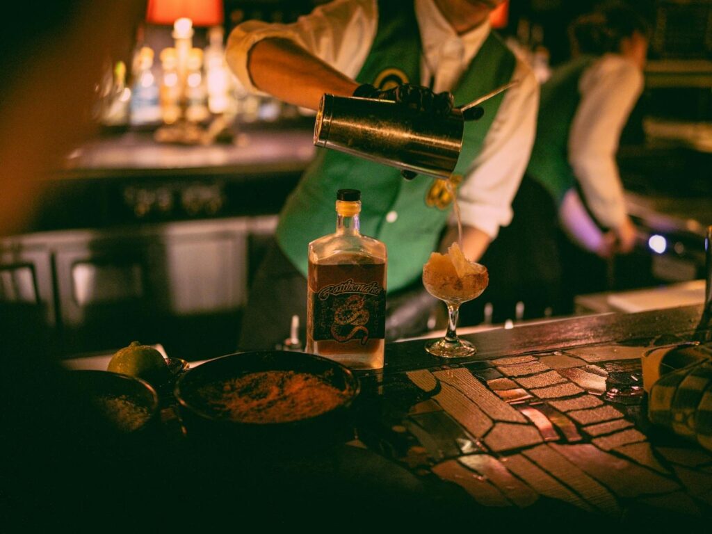 Sydney's cocktail scene runs from rooftop margaritas to hidden rum basements — here are the 10 bars worth building a night around.