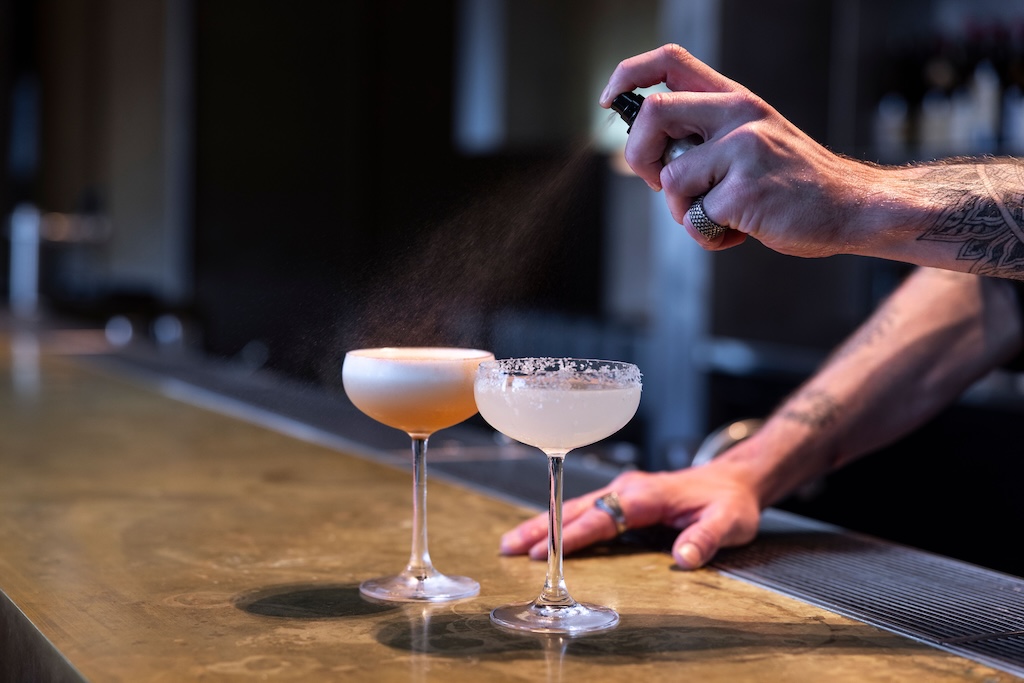 Sydney's cocktail scene runs from rooftop margaritas to hidden rum basements — here are the 10 bars worth building a night around.