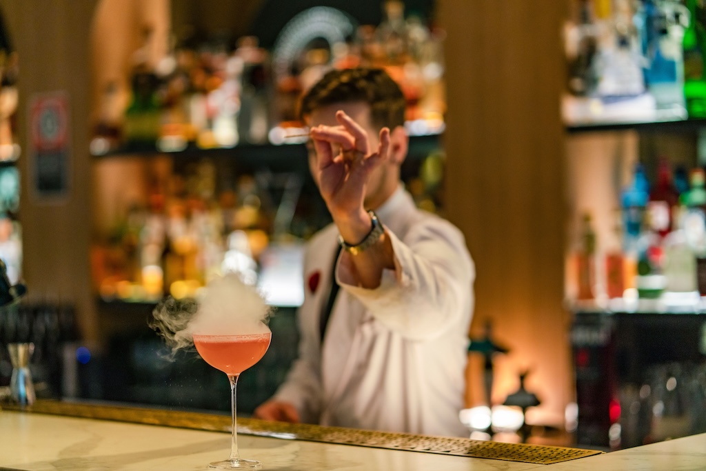 Sydney's cocktail scene runs from rooftop margaritas to hidden rum basements — here are the 10 bars worth building a night around.