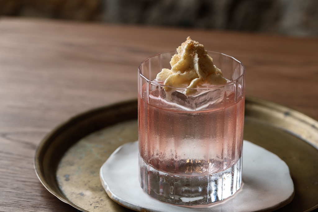 Sydney's cocktail scene runs from rooftop margaritas to hidden rum basements — here are the 10 bars worth building a night around.
