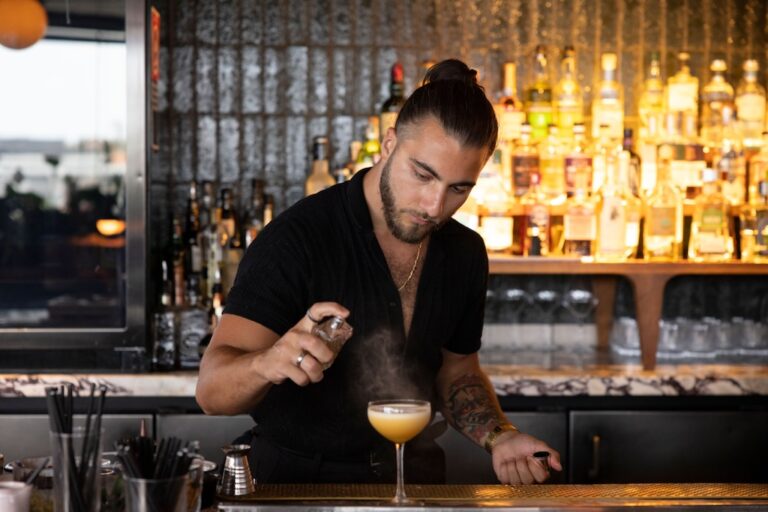 Sydney's cocktail scene runs from rooftop margaritas to hidden rum basements — here are the 10 bars worth building a night around.