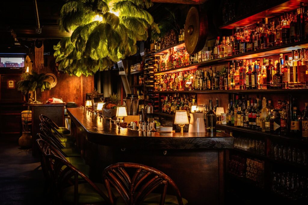 Sydney's cocktail scene runs from rooftop margaritas to hidden rum basements — here are the 10 bars worth building a night around.