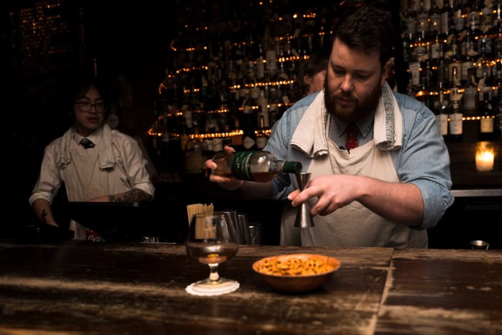 Sydney's cocktail scene runs from rooftop margaritas to hidden rum basements — here are the 10 bars worth building a night around.
