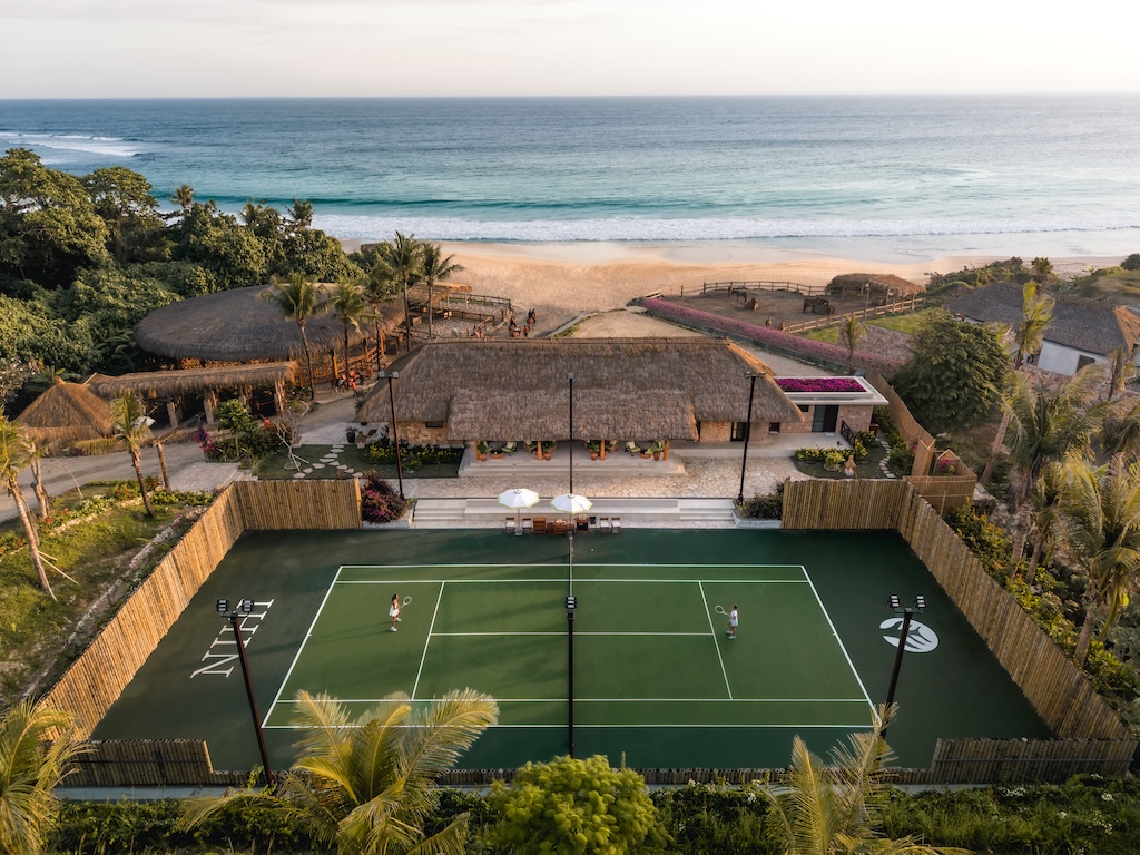 NIHI Sumba unveils the Riding and Racquet Club, a beachfront sanctuary blending equestrian tradition, sporting club nostalgia, and the island's untamed beauty, framed by horses.