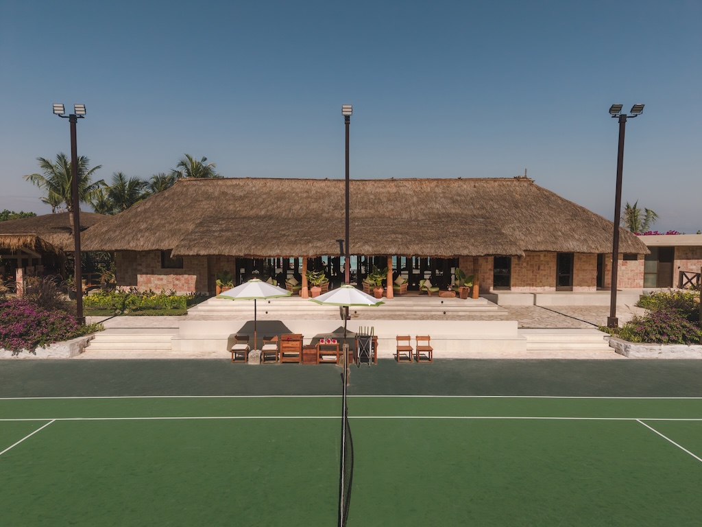 NIHI Sumba unveils the Riding and Racquet Club, a beachfront sanctuary blending equestrian tradition, sporting club nostalgia, and the island's untamed beauty, framed by horses.