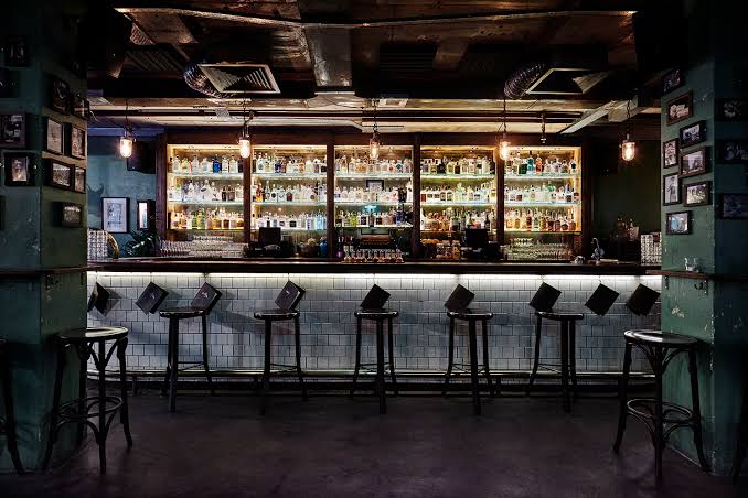 Sydney's cocktail scene runs from rooftop margaritas to hidden rum basements — here are the 10 bars worth building a night around.