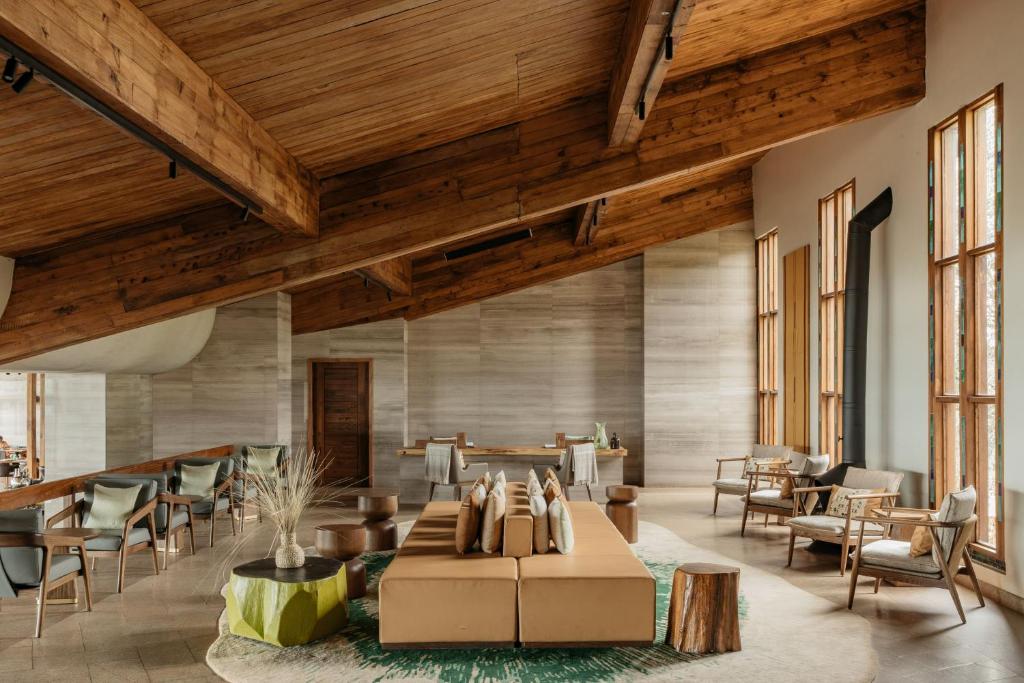 From andBeyond's storied rim palace to Gibb's Farm's coffee-scented hills, these are the luxury safari lodges turning Ngorongoro Crater into East Africa's most spectacular stay.