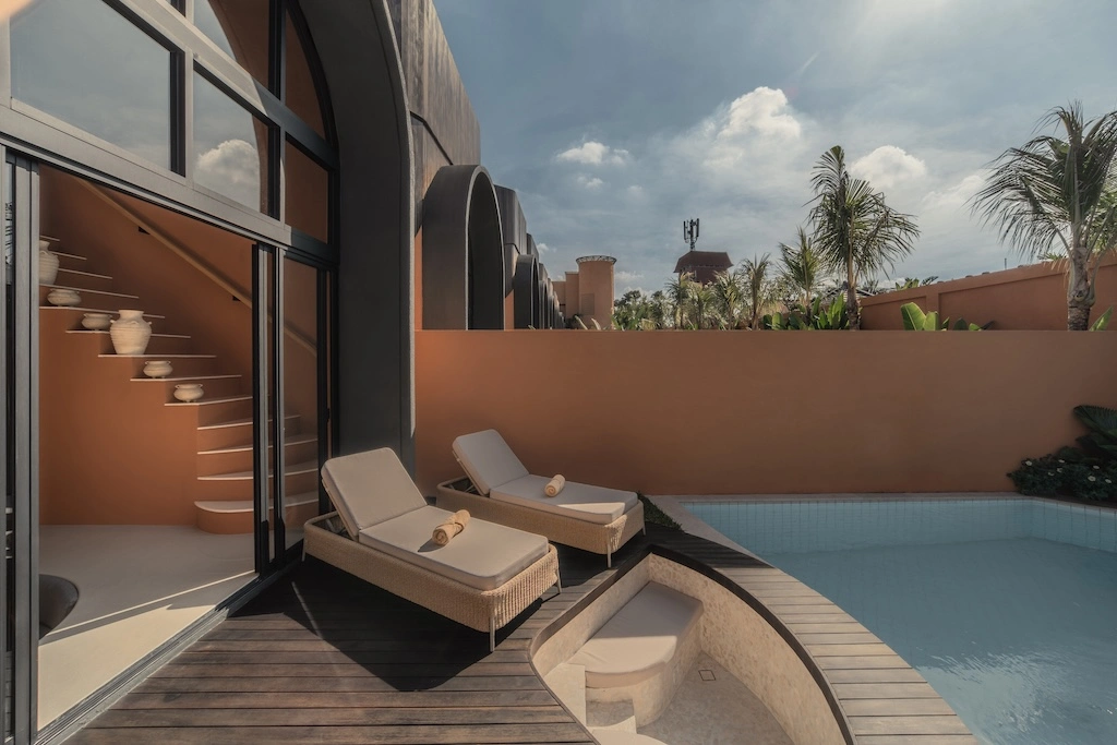 With just ten private pool villas, Ajowa Resort & Spa Seminyak swaps Bali's grand gestures for sculpted terracotta, quiet gardens and grounded luxury.