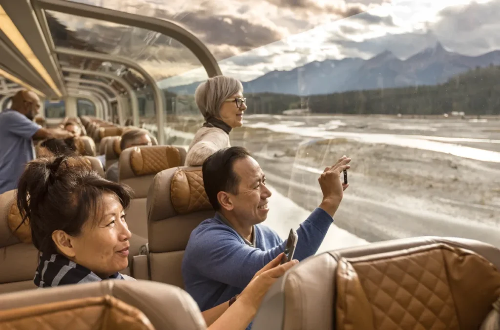 guests under the glass dome of a Rocky Mountaineer GoldLeaf carriage